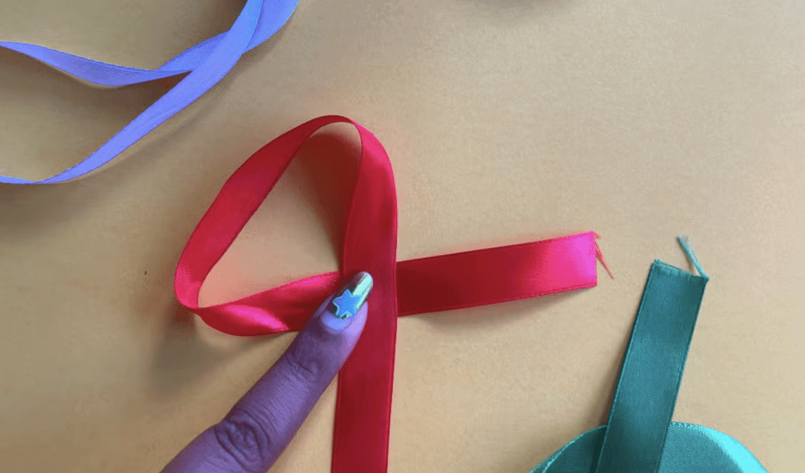 Step_3_Form_a_Classic_Charity_Ribbon_Shape_by_Crossing_One_Side_Over_the_Other