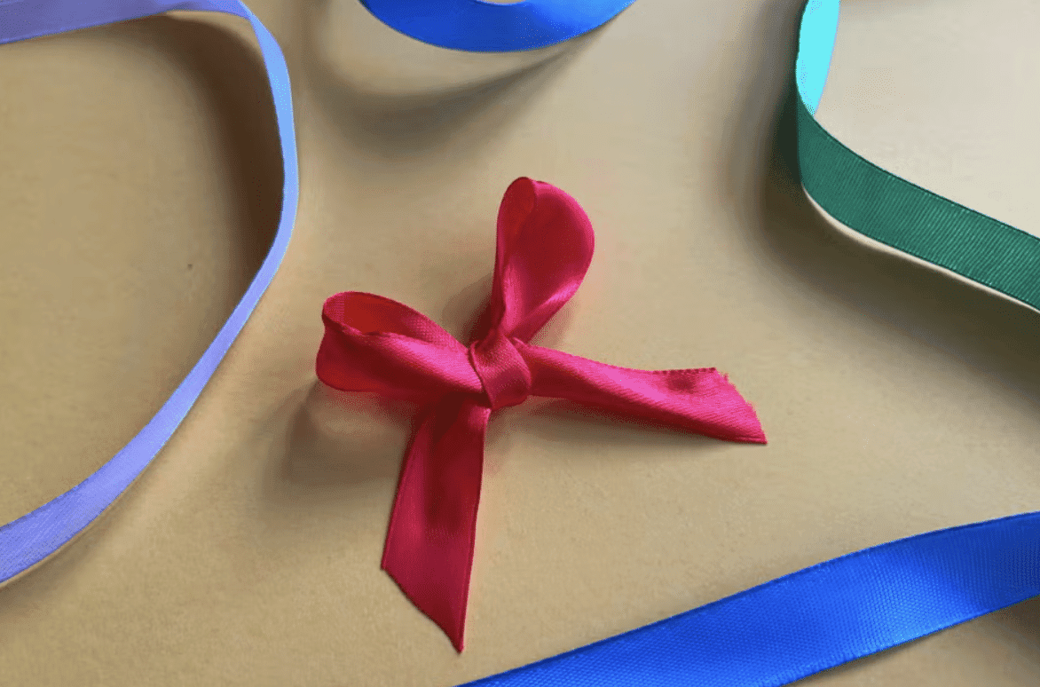 Step_6_Adjust_the_Loops_and_Tails_for_Symmetry_Then_Trim_the_Ends_at_an_Angle